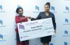 Nsope being presented with a dummy cheque from Nalikungwi